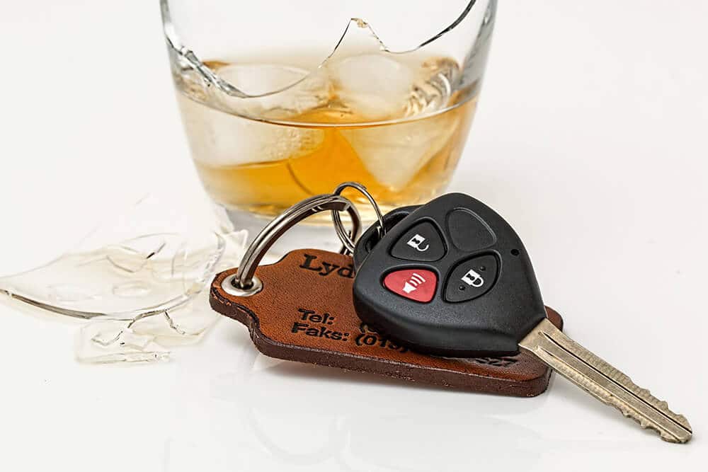 Keys in front of an alcoholic drink