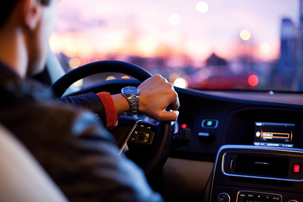 Man behind wheel of vehicle